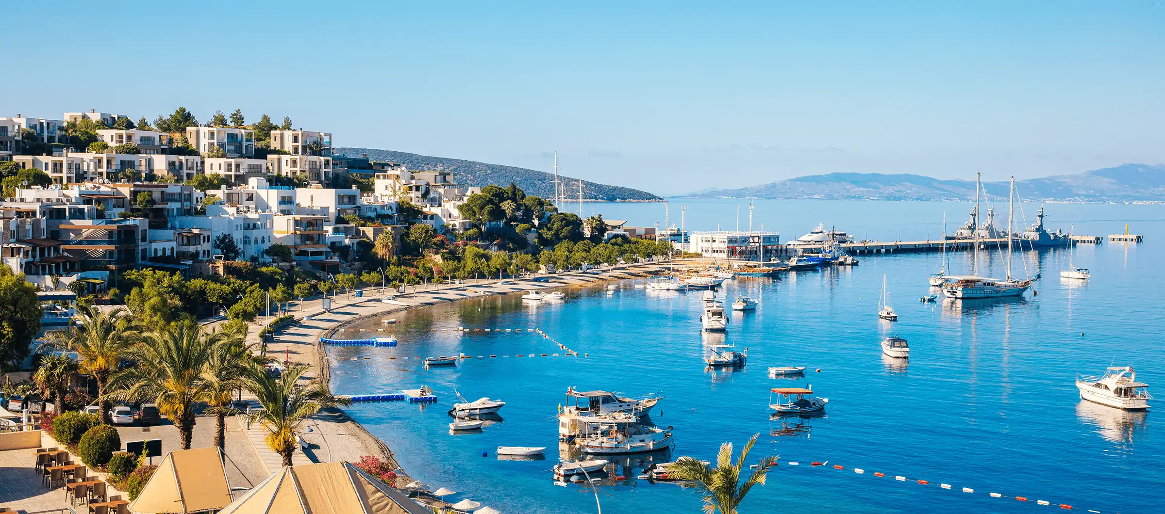 Bodrum marina with yachts and turquoise sea along the Turkish coast